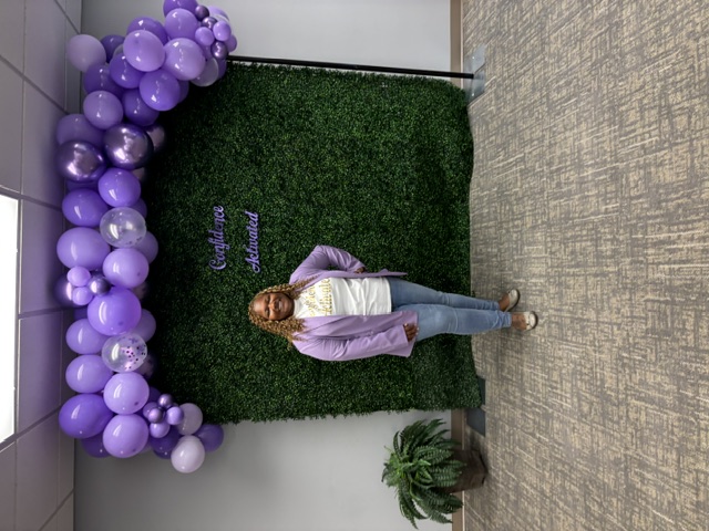 Elena standing in front of the Confidence Activated backdrop
